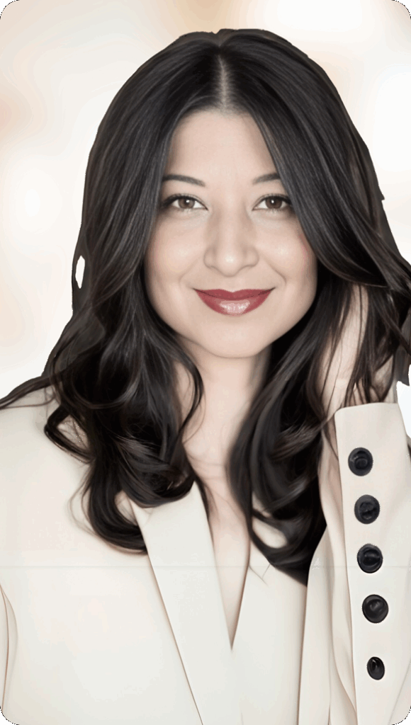 Woman in cream blazer smiling confidently in portrait photo
