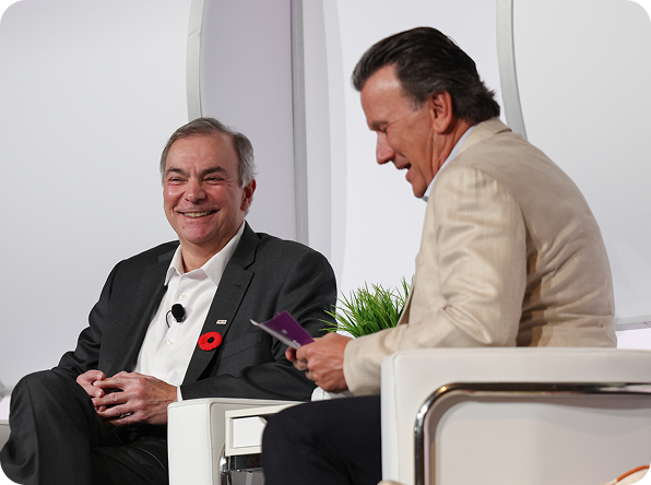 Richard Robbins interviewing a guest on stage at Masters Academy