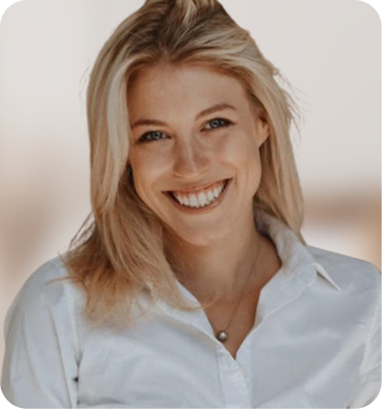 Portrait of a smiling woman in a white shirt with blonde hair