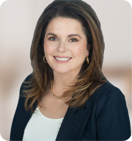 Portrait of a smiling woman in a navy blazer and white top